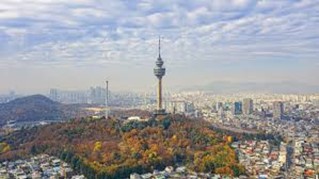 A large park and Gyeongsang City with a TV tower